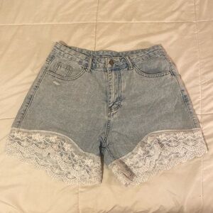 Denim shorts with lace on the bottom